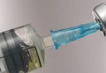 close up of vaccine syringe_canstockphoto89698638 1000x800