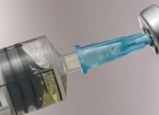 close up of vaccine syringe_canstockphoto89698638 1000x800
