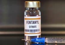 fentanyl vial next to a syringe