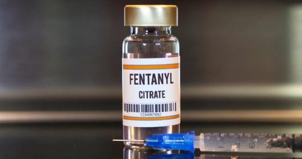 fentanyl vial next to a syringe