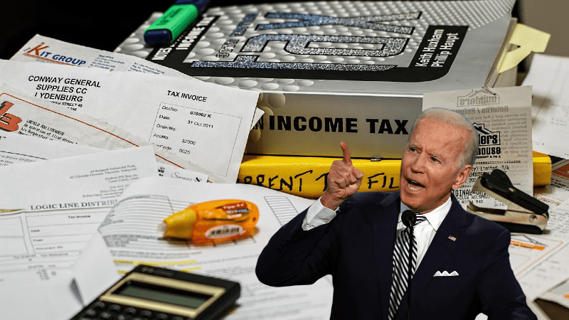 joe biden pointing to income tax rule book