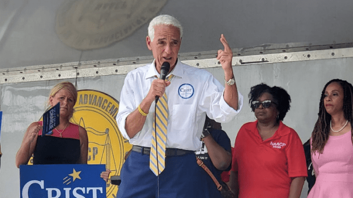 Charlie Crist talking on microphone